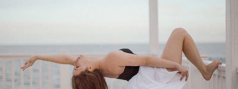 A person in a fluid, stretching motion.