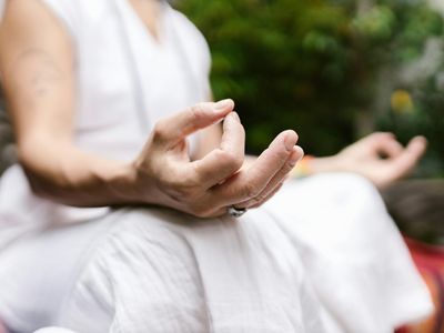 Close-up of hands in a meditative mudra.